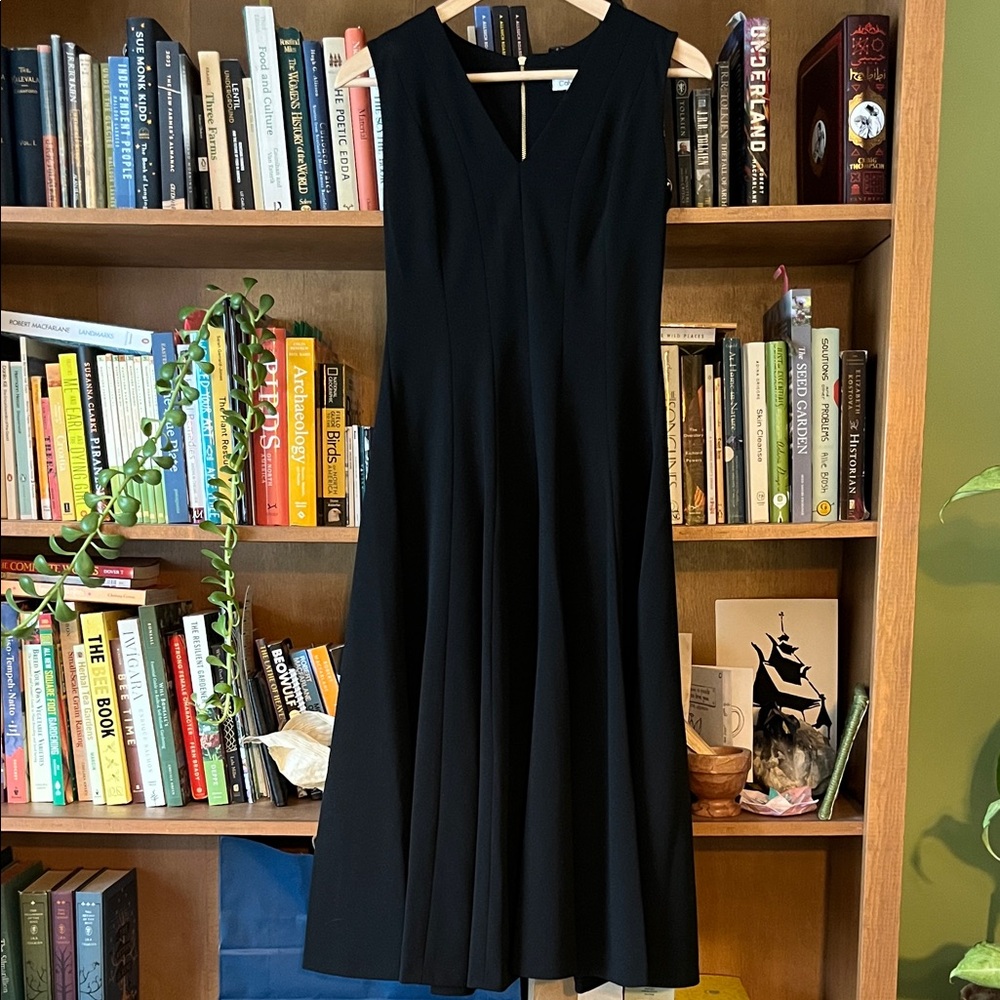 Calvin Klein. Black polyester/spandex midi dress.